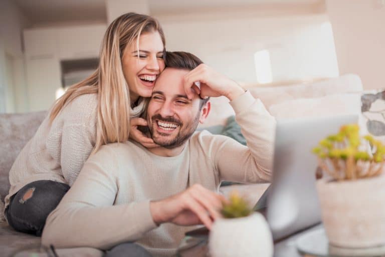 woman hugging man from behind