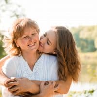 daughter hugging her mother