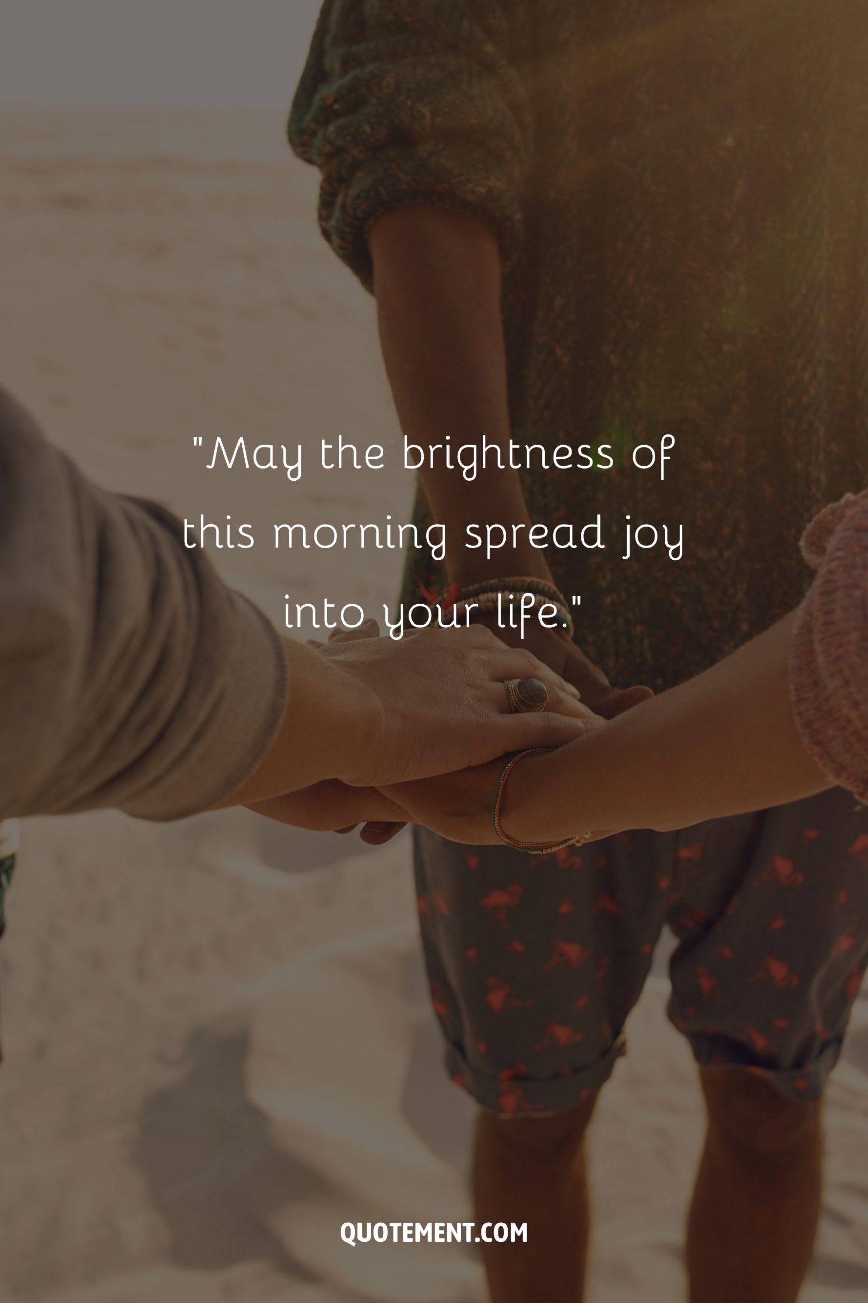 A warm, sunlit scene of three people's hands interlocked