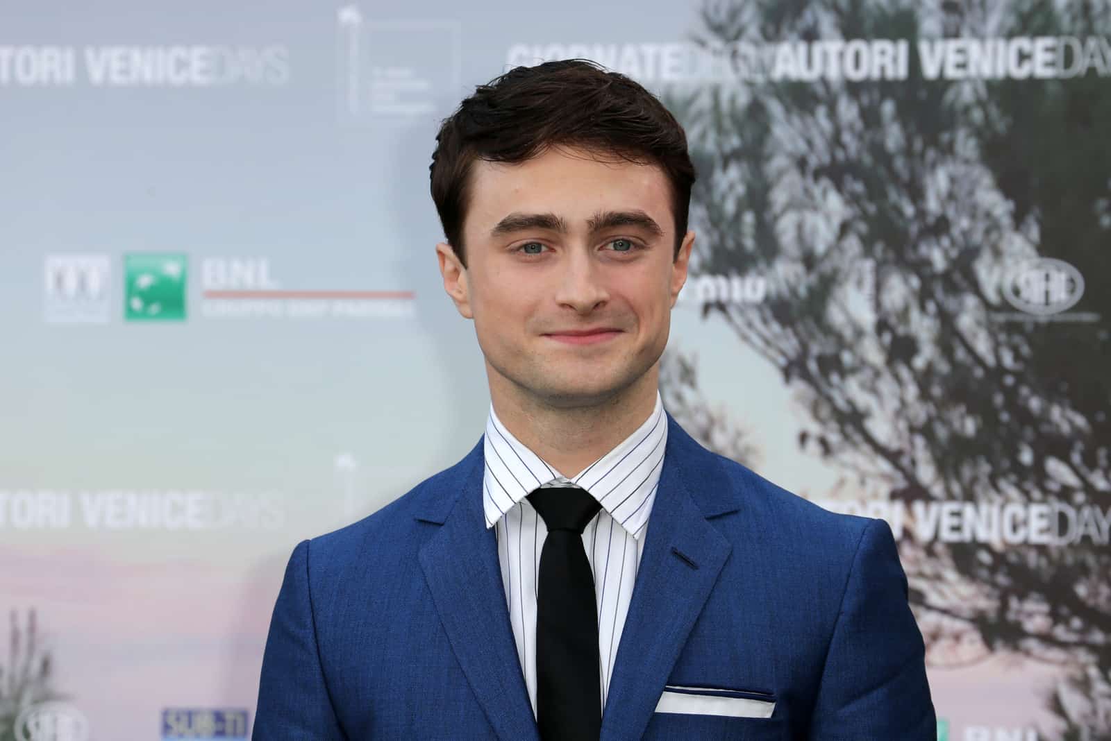 Daniel Radcliffe posing on film festival