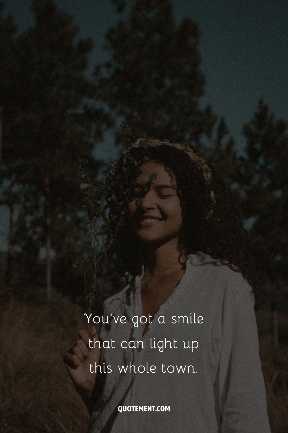 a girl in the woods smiling representing cute picture caption
