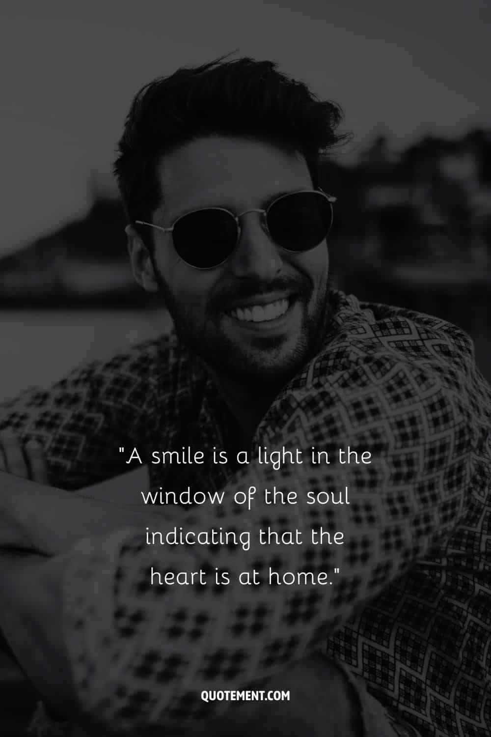 a handsome young man representing quote about living with a smile on