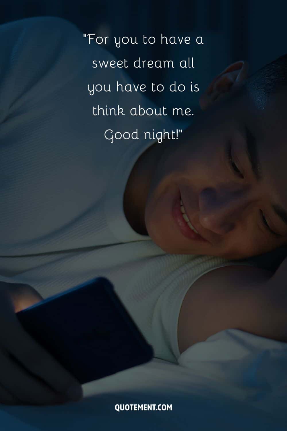 a smiling guy with phone in his hand representing sweet dreams love message for him
