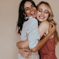 two sisters hugging