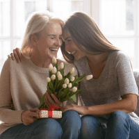 young woman hugging her aunt for birthday