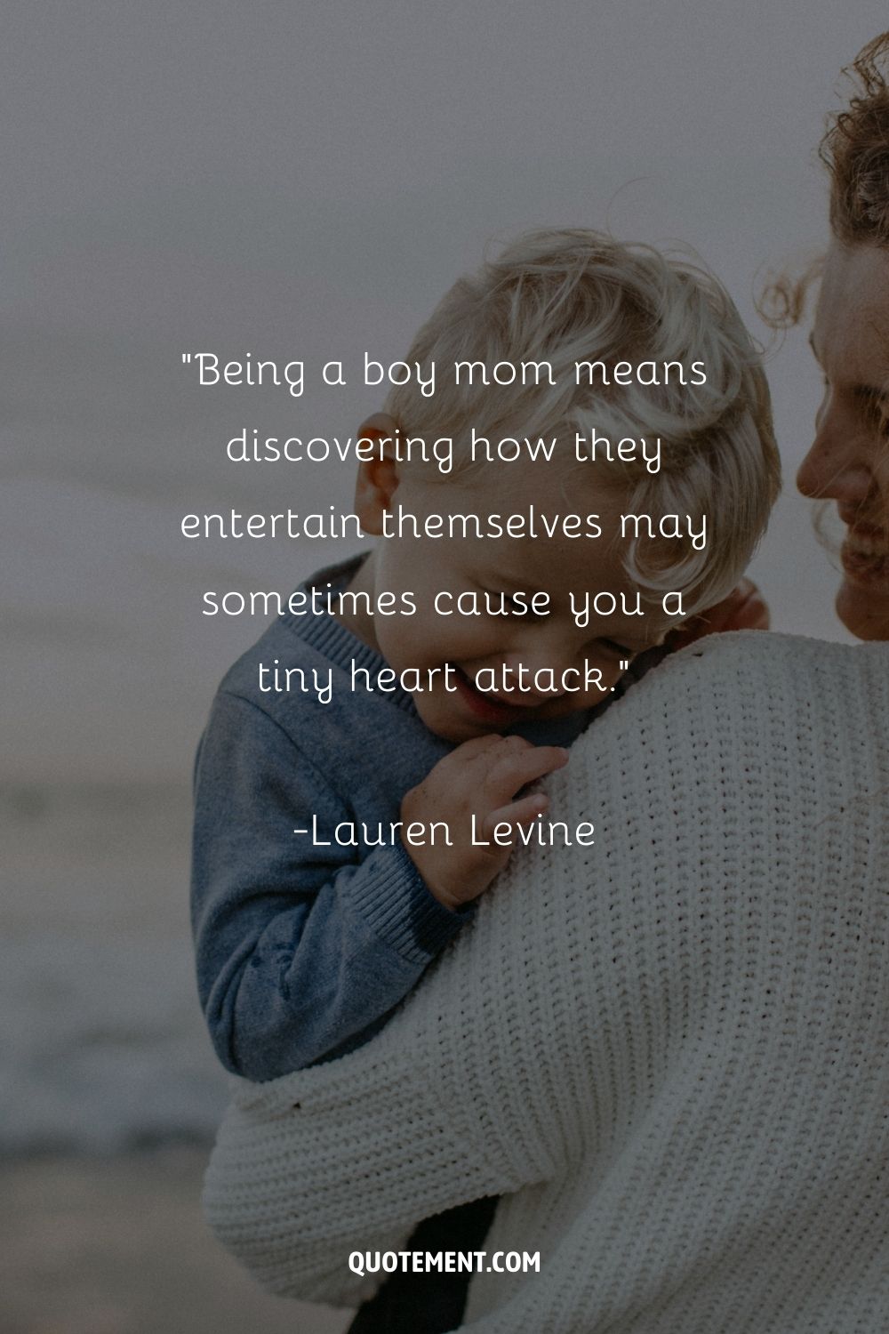 A boy lays his head on his mom's shoulder, both gazing to the left