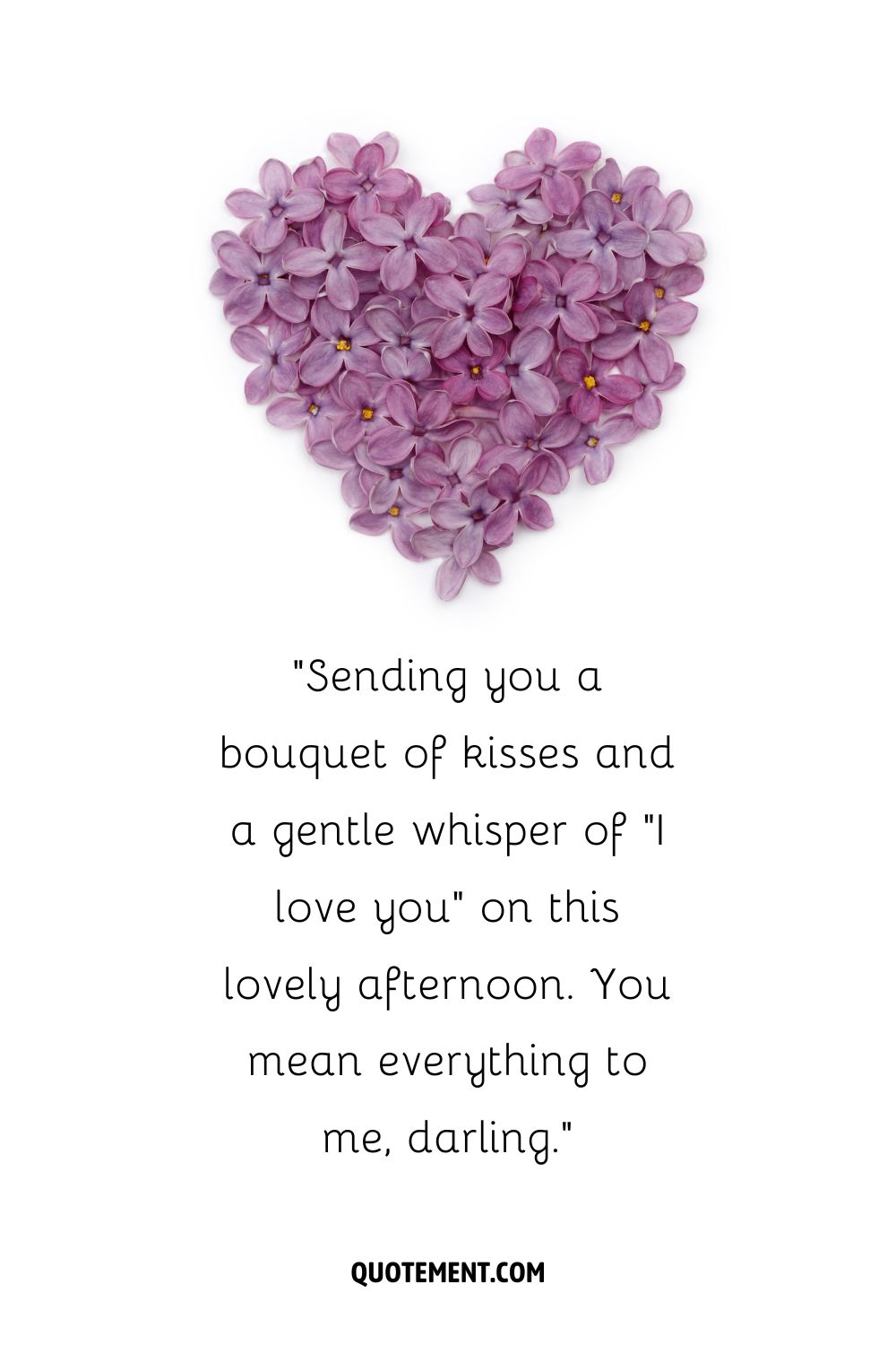 A heart made from clusters of purple lilac flowers on a white background
