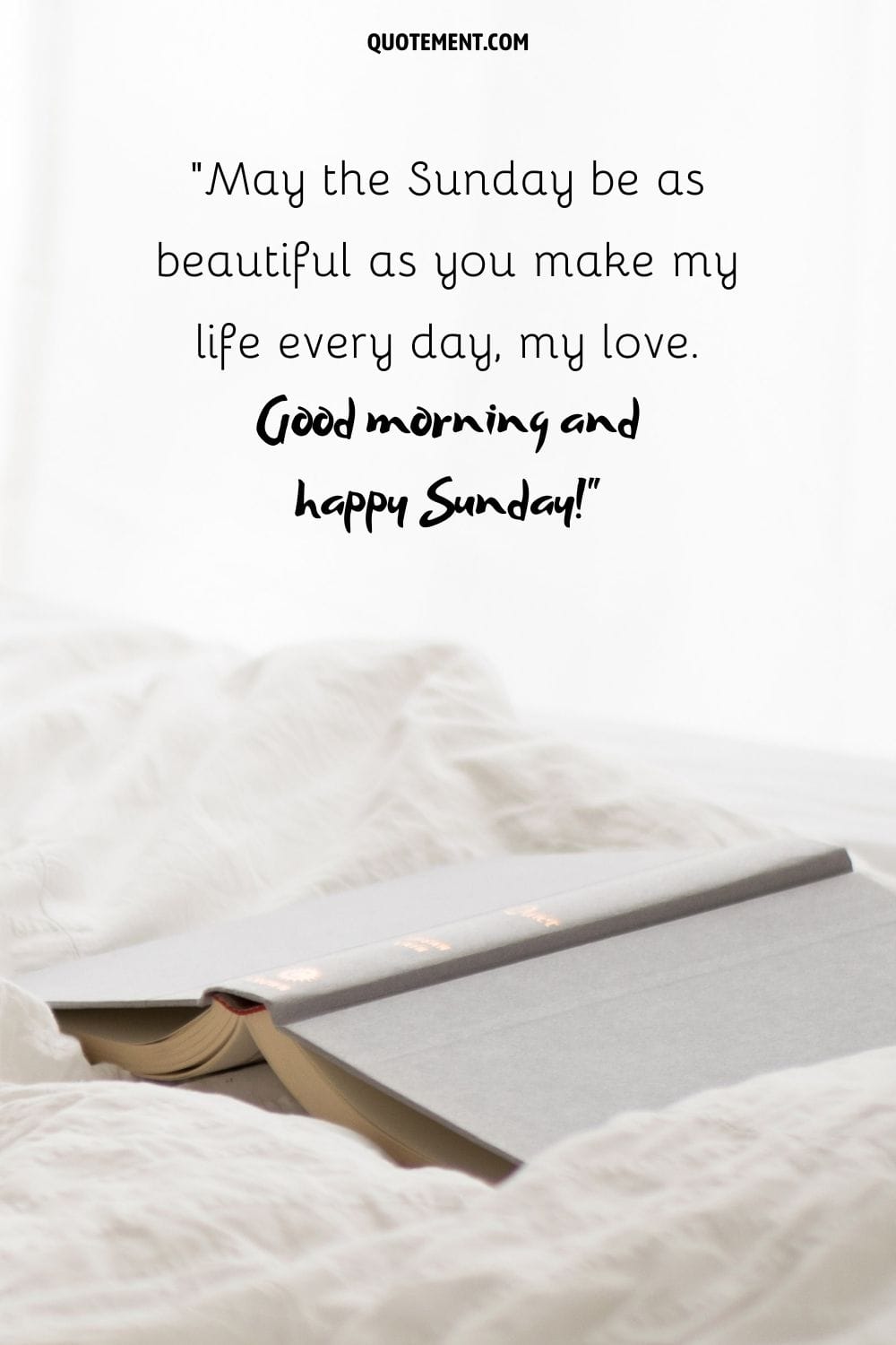 dark book on white sheets representing sunday good morning wish for a friend