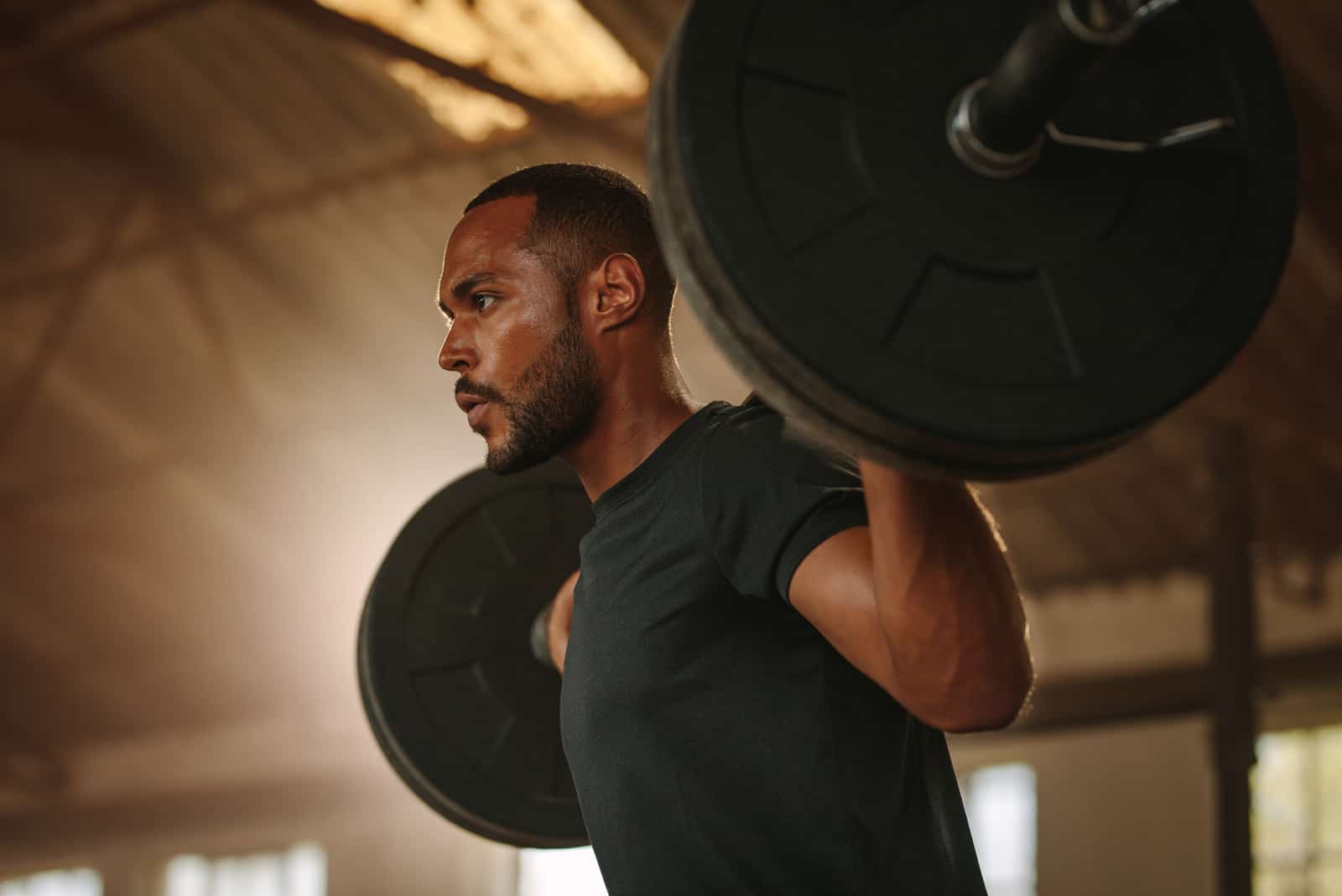 man lifting weights