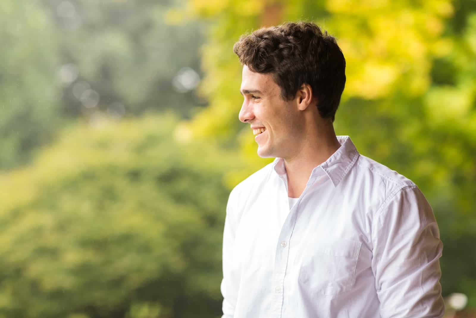 side portrait of a cheerful young man