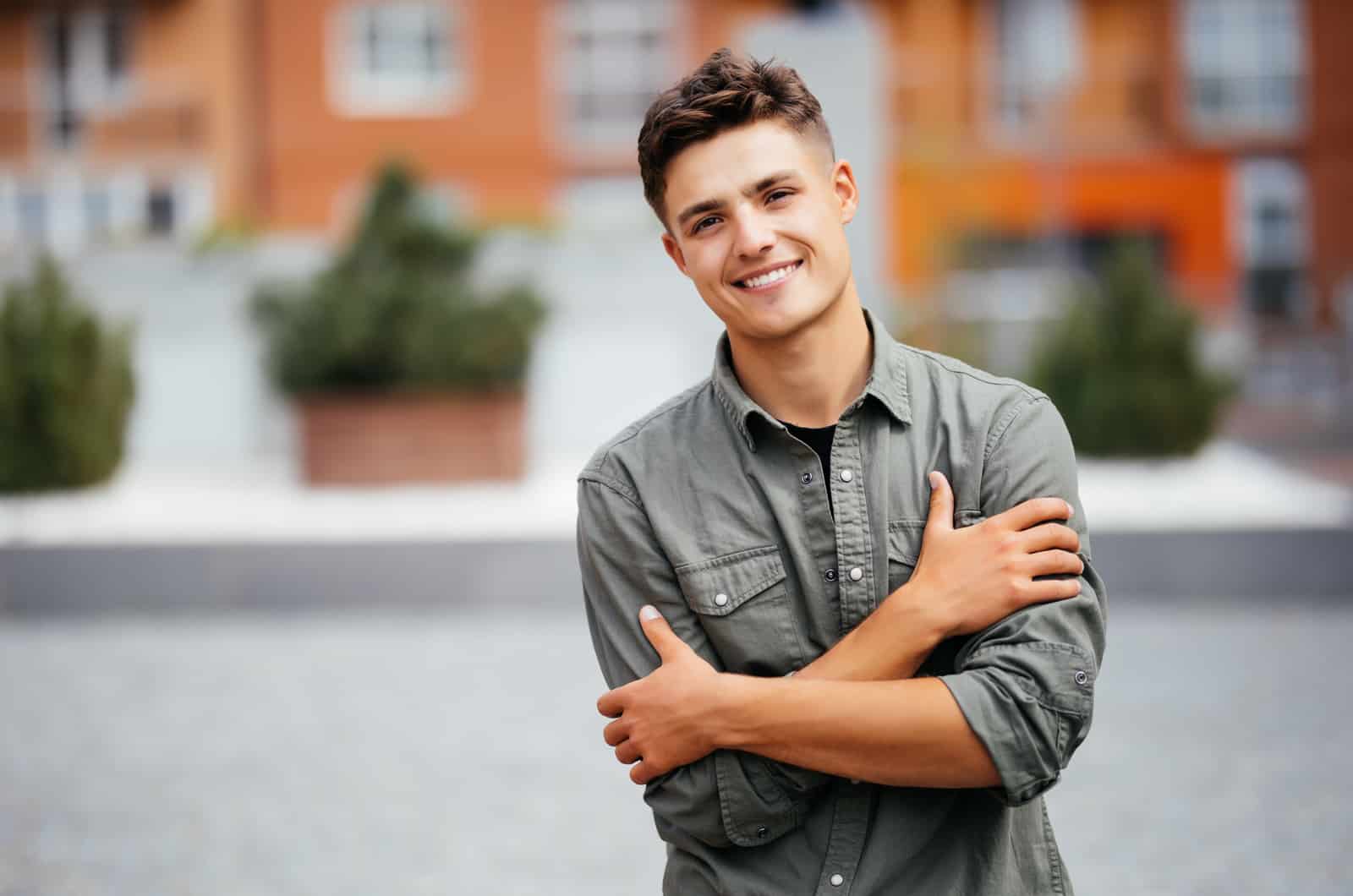 trendy young man posing in the city