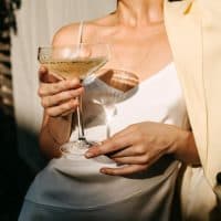 classy woman drinking a cocktail