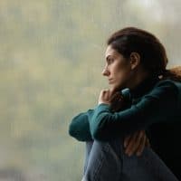 woman sitting by window