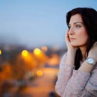 woman standing outside at night