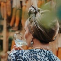 woman drinking cocktail