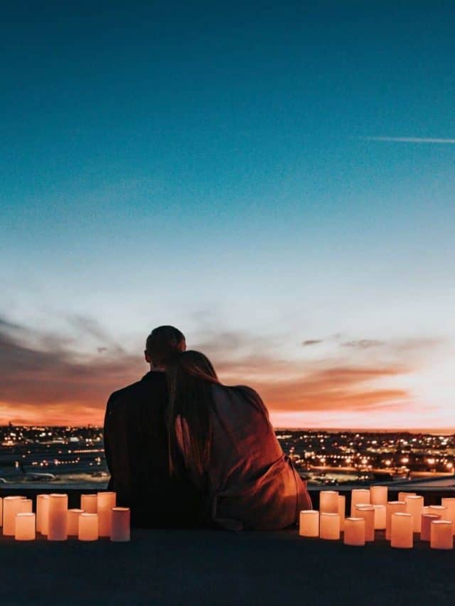 happy couple on a romantic date with candles