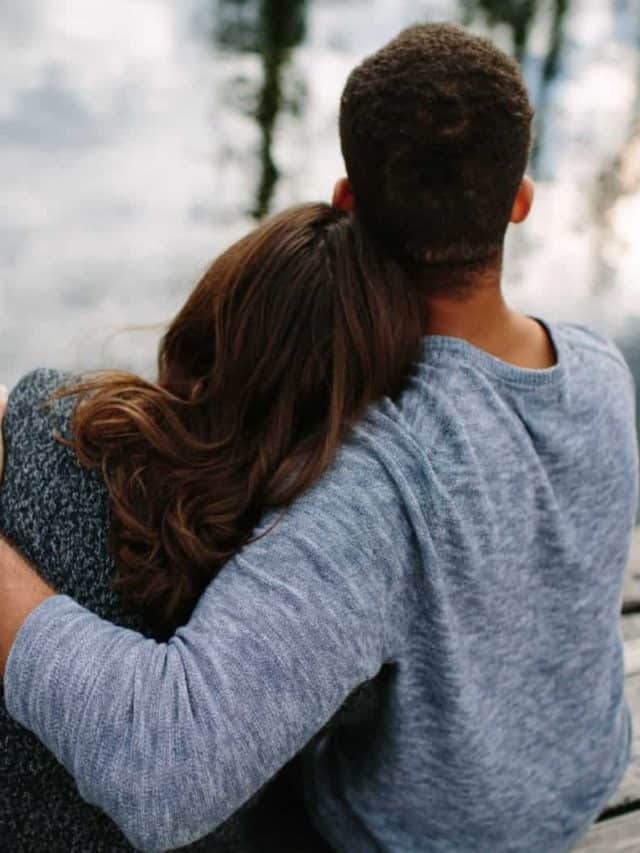 man and woman hugging