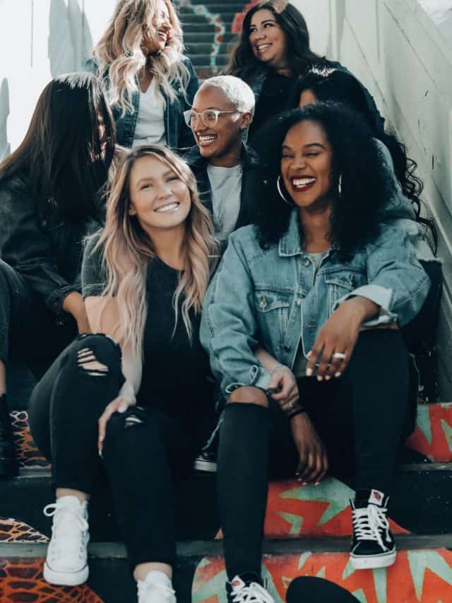 friends talking and laughing on the stairs