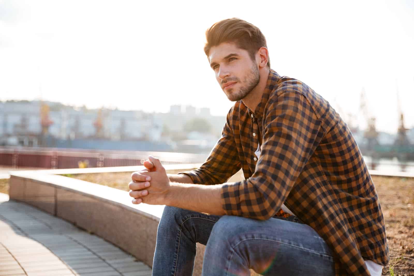 man sitting on wall