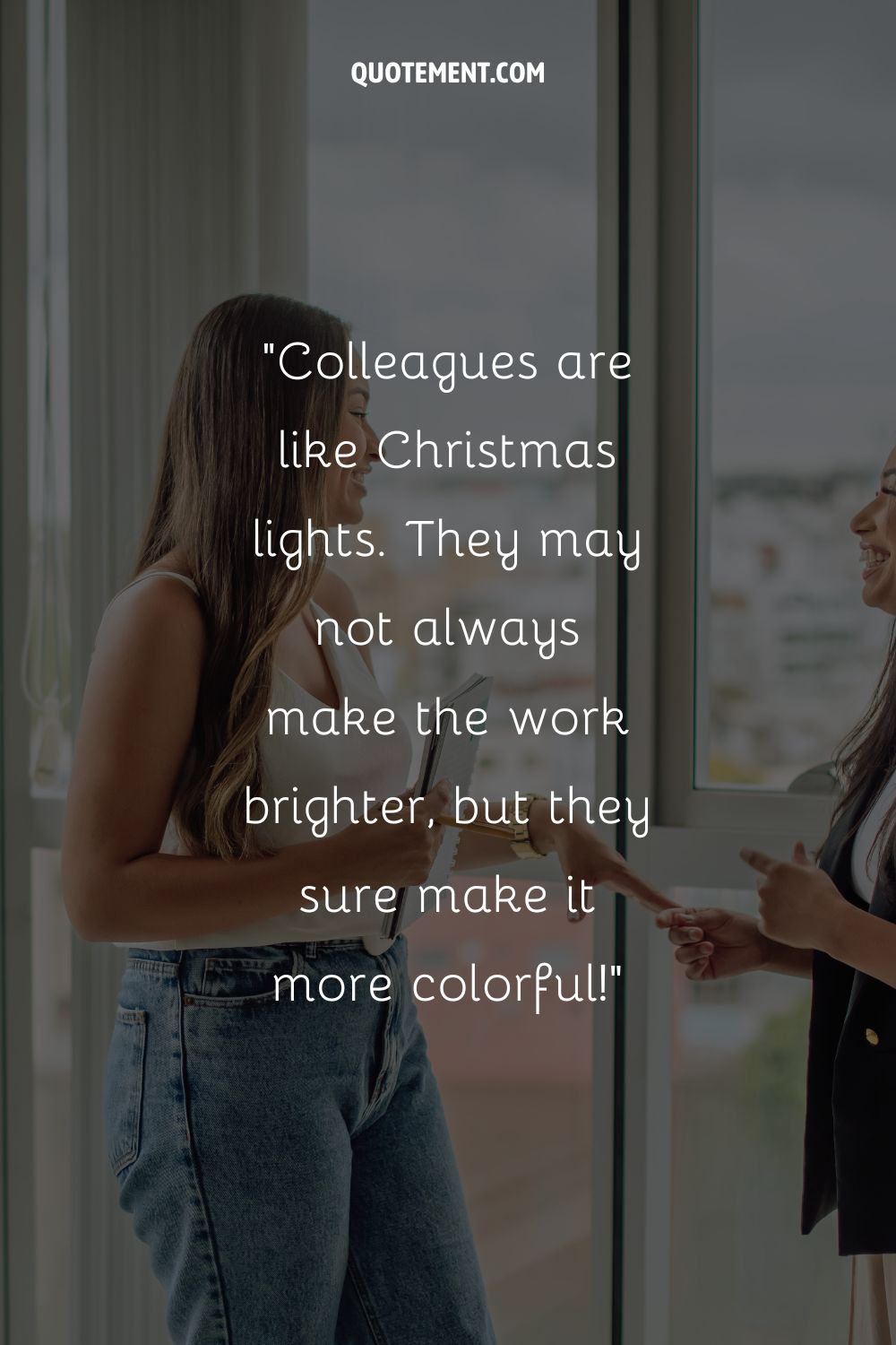 two colleagues laughing in office representing colleagues quote
