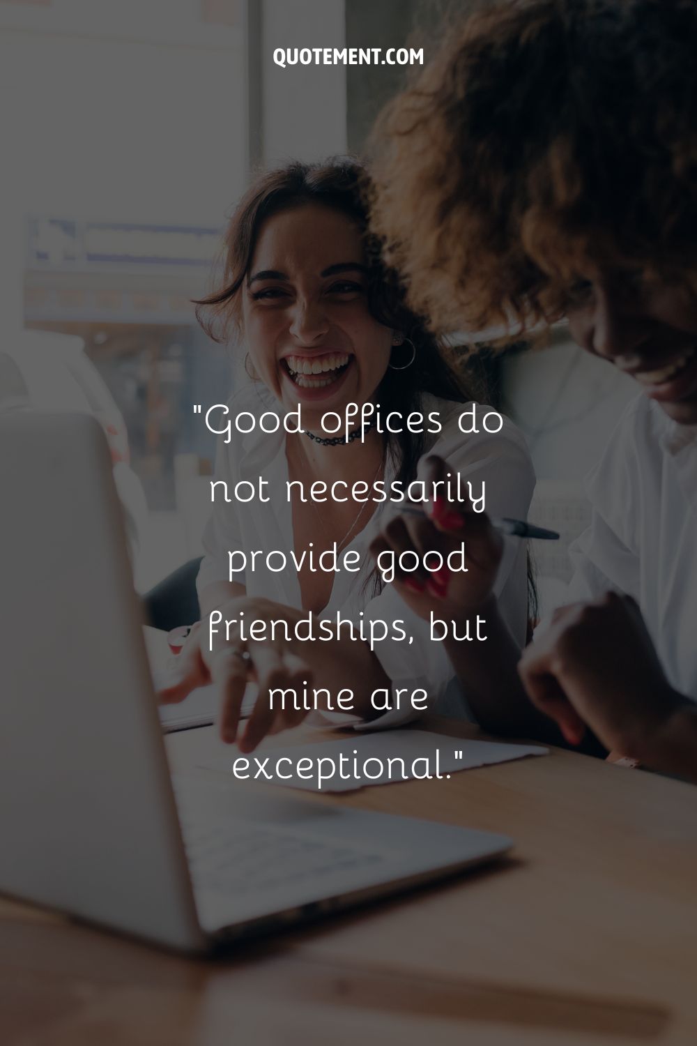 two girls laughing aloud at the office representing coworker friendship quote
