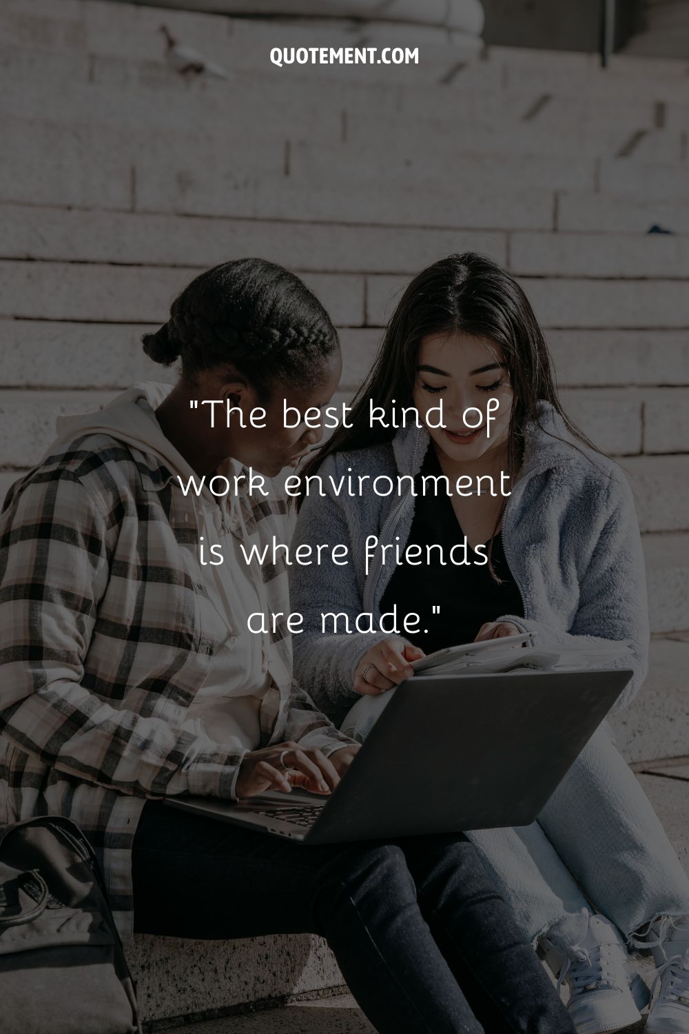 two girls working on a laptop representing work bestie quote