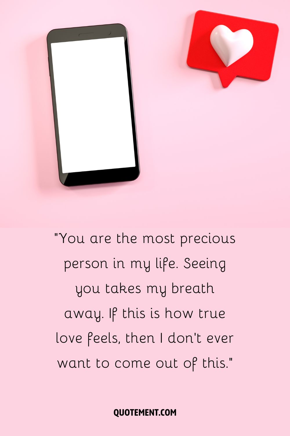 A phone with a white screen and a red speech bubble with a white heart next to it
