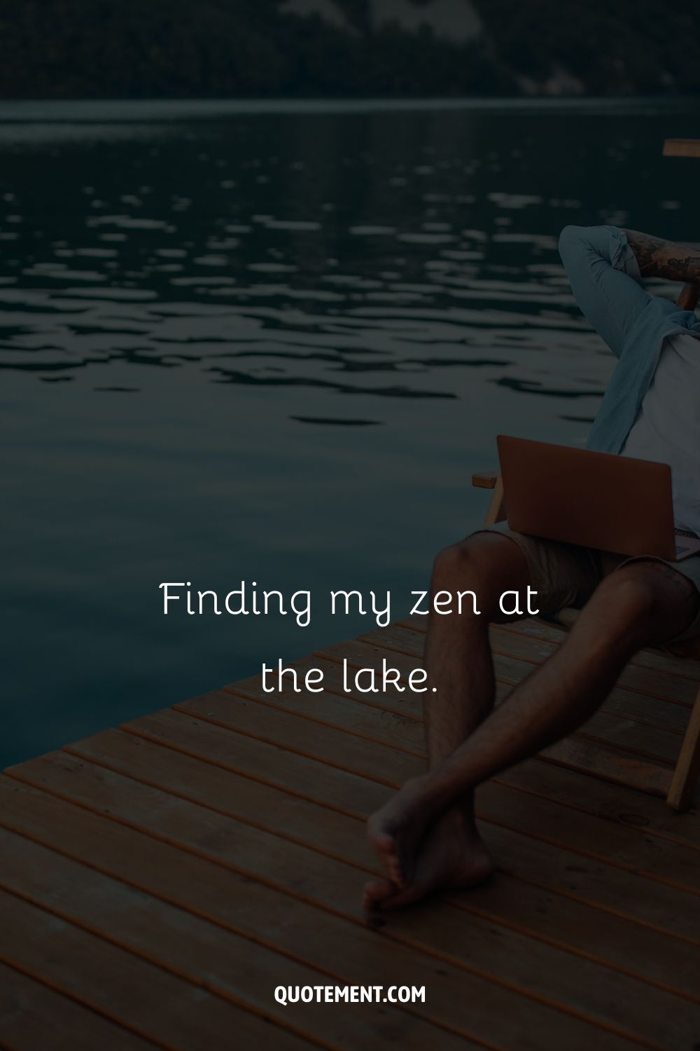 a man doing remote work by the lake representing lake quote