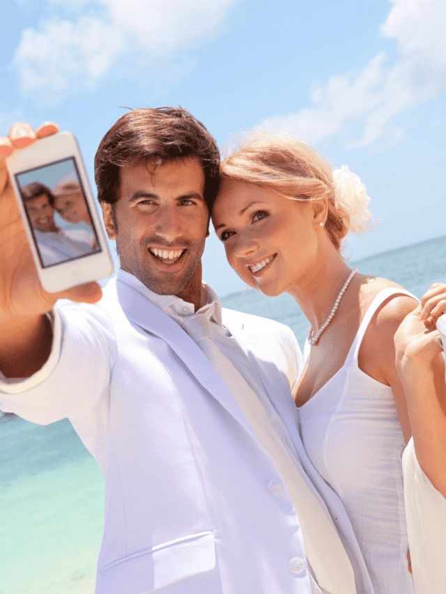 a smiling woman takes a picture with a man before the wedding