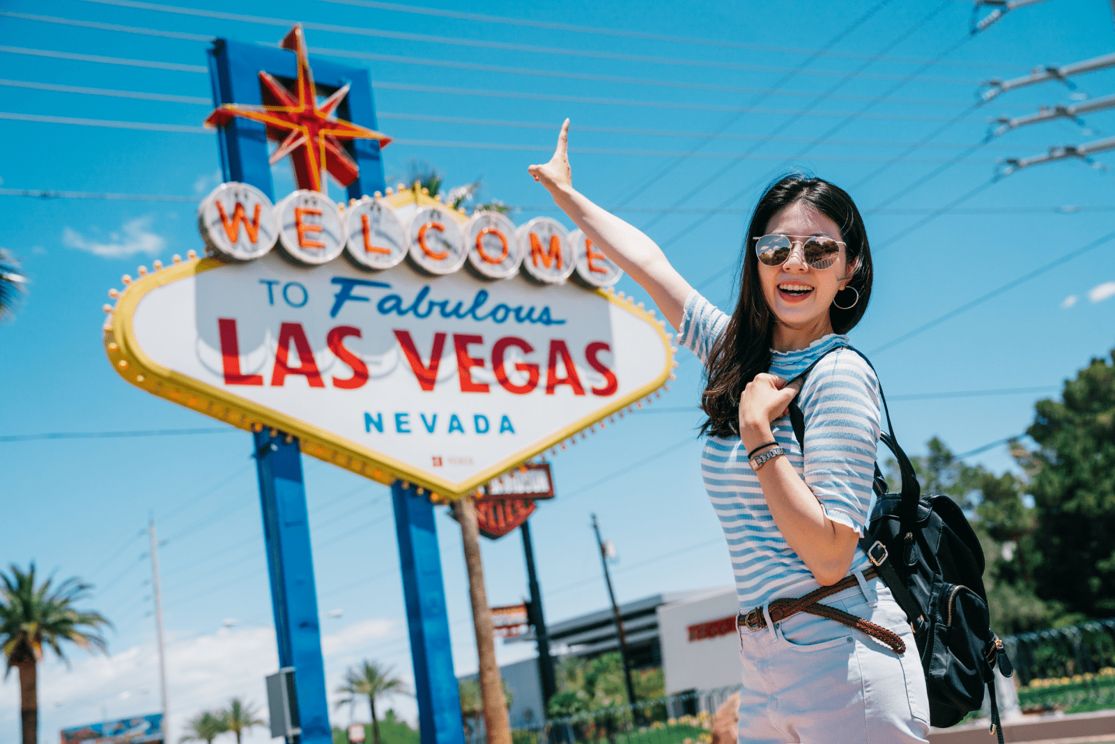 a smiling woman takes a picture in Las Vegas