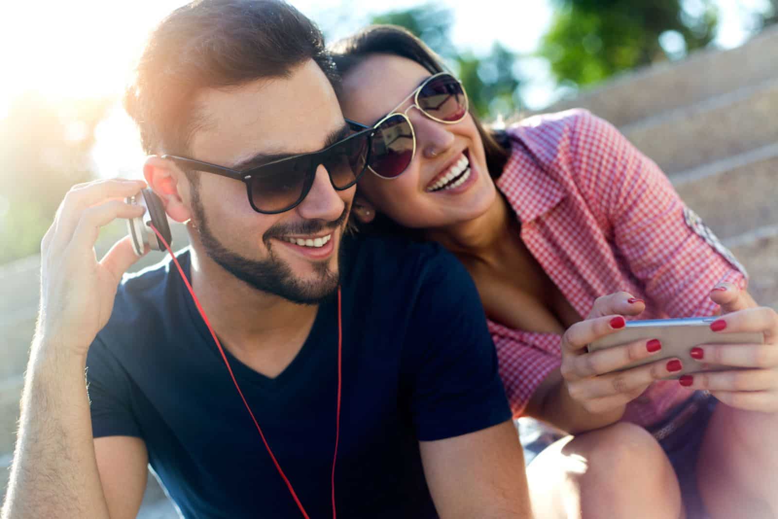 happy couple listening music together