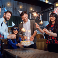 a woman celebrates her birthday with friends