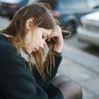 sad woman sitting alone