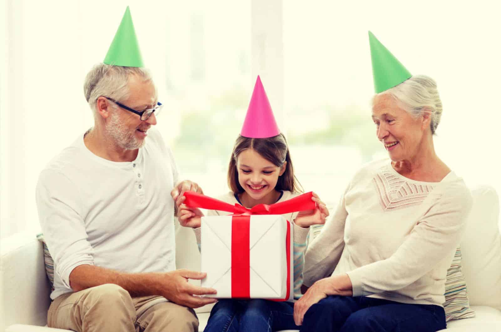 grandparents with gtheir granddaughter for her birthday