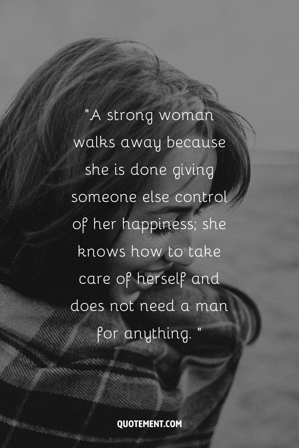 a girl smiling looking down representing woman walking alone quote