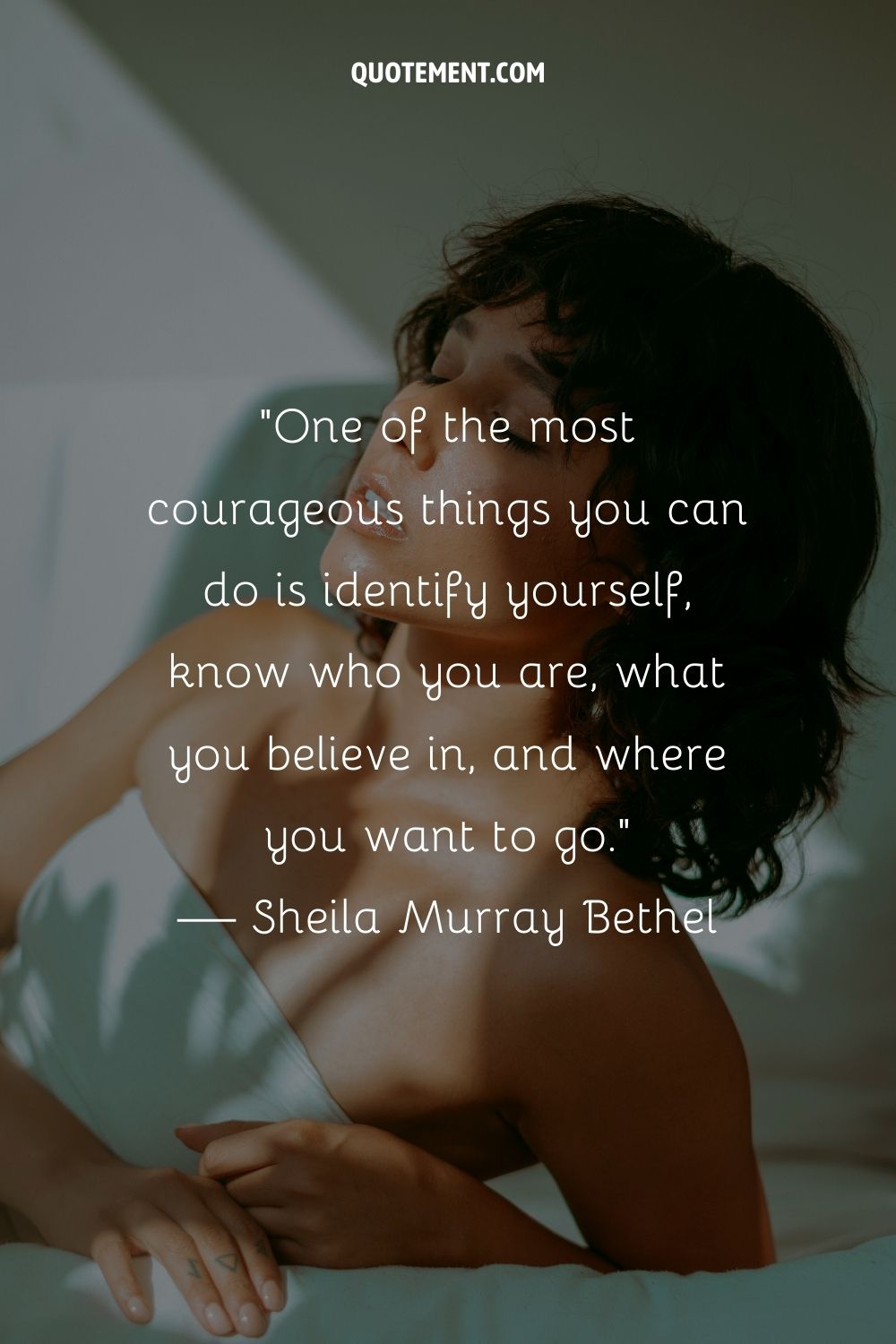 a girl with short black hair representing strong willed woman quote
