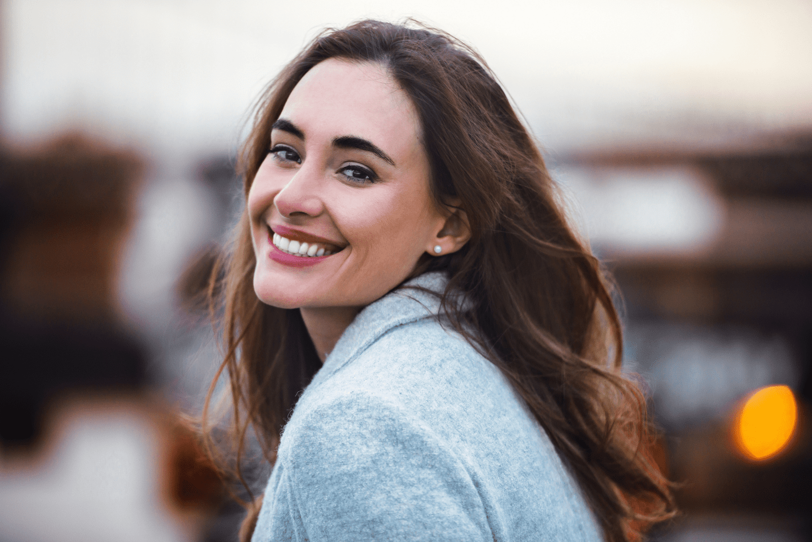 beautiful smiling woman with long brown hair