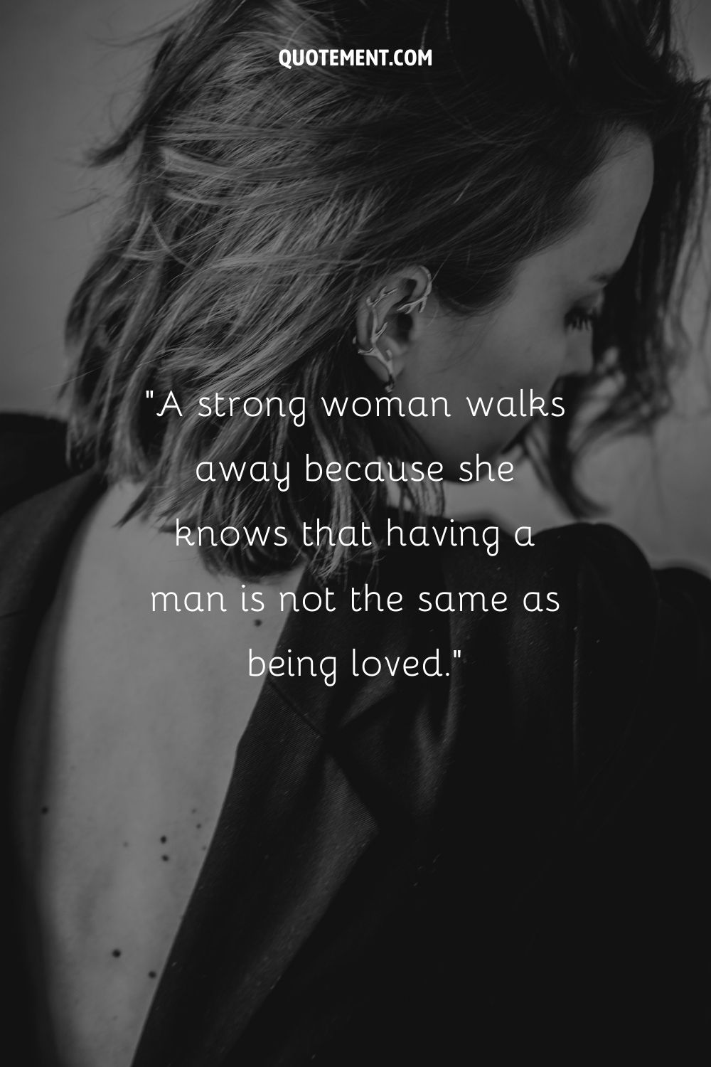 beautiful woman in a black open back dress representing single strong woman quote
