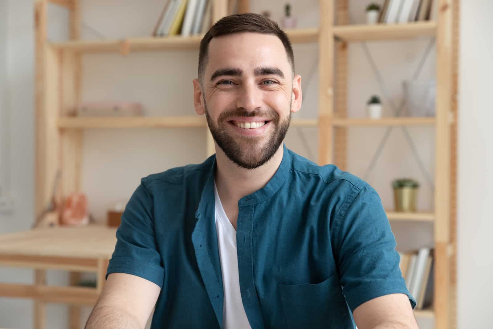 smiling man posing at camera