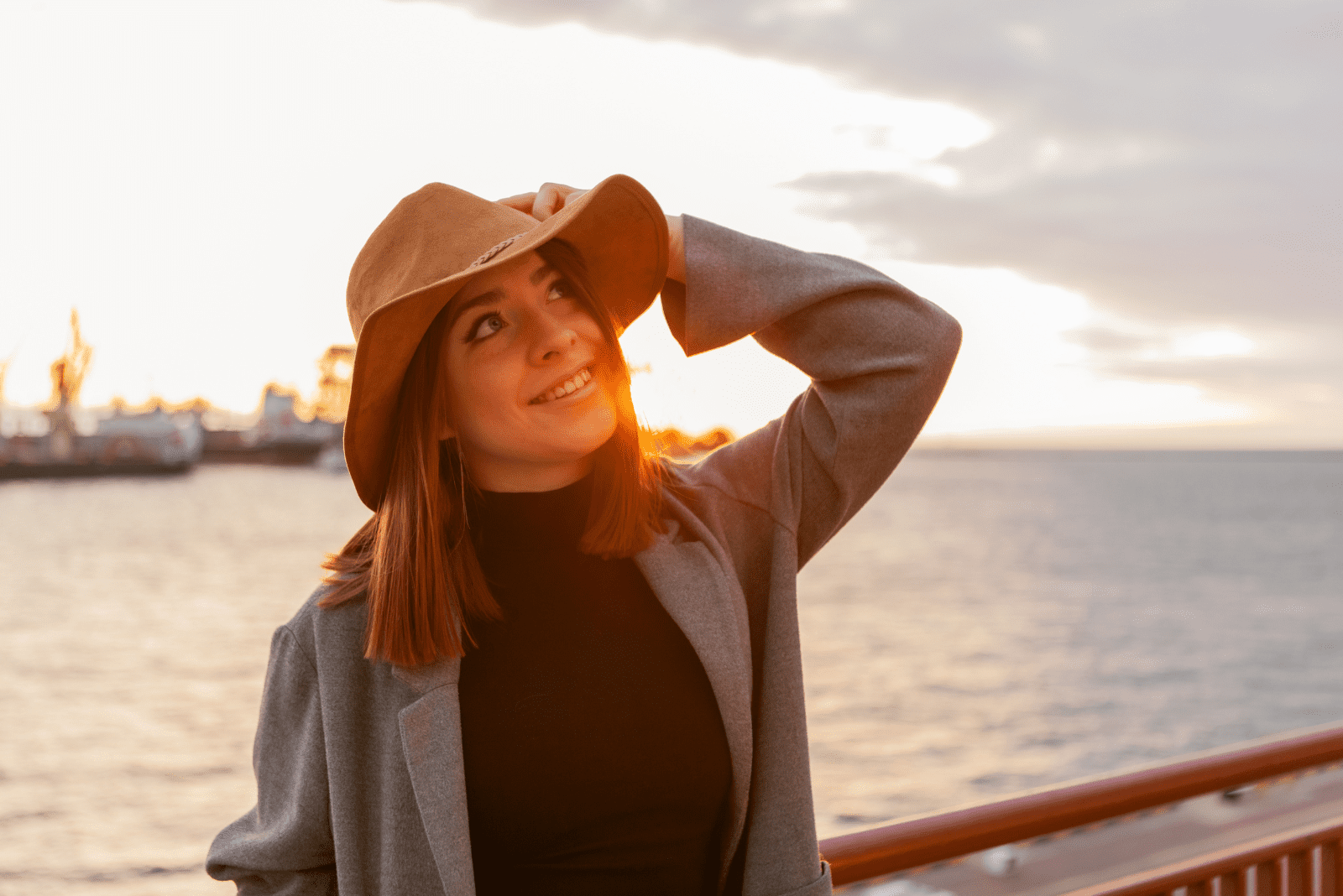 smiling woman with a hat on her head