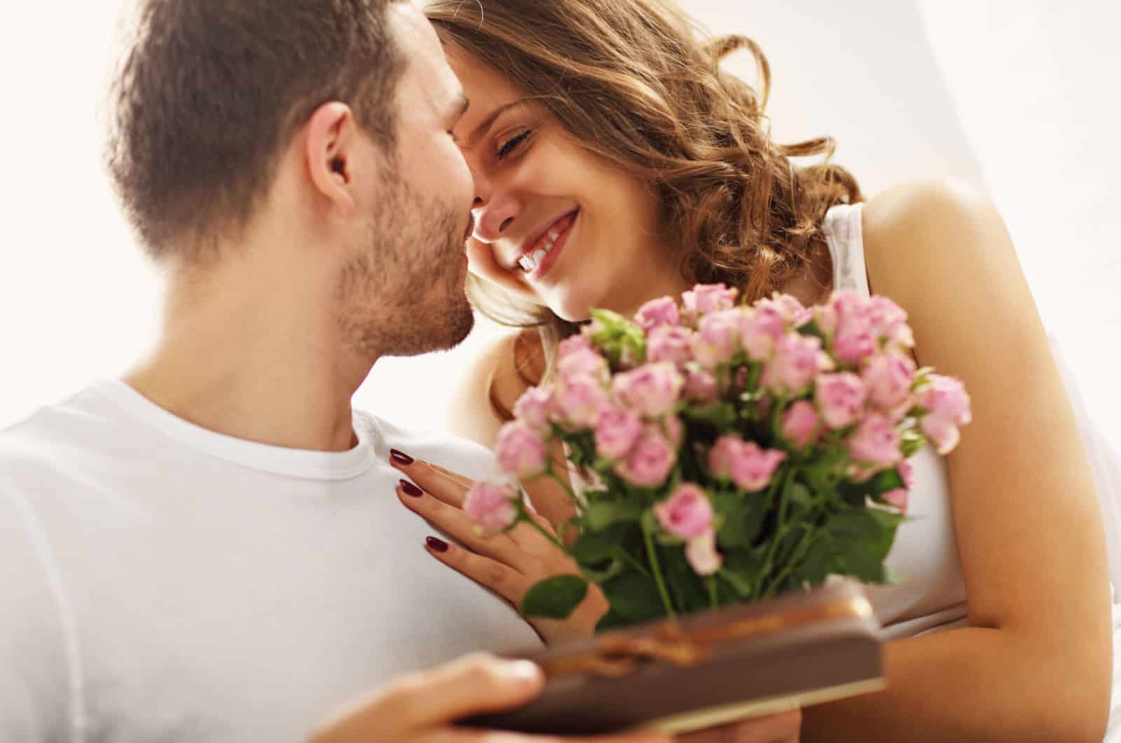 man giving flowers to his girlfriend