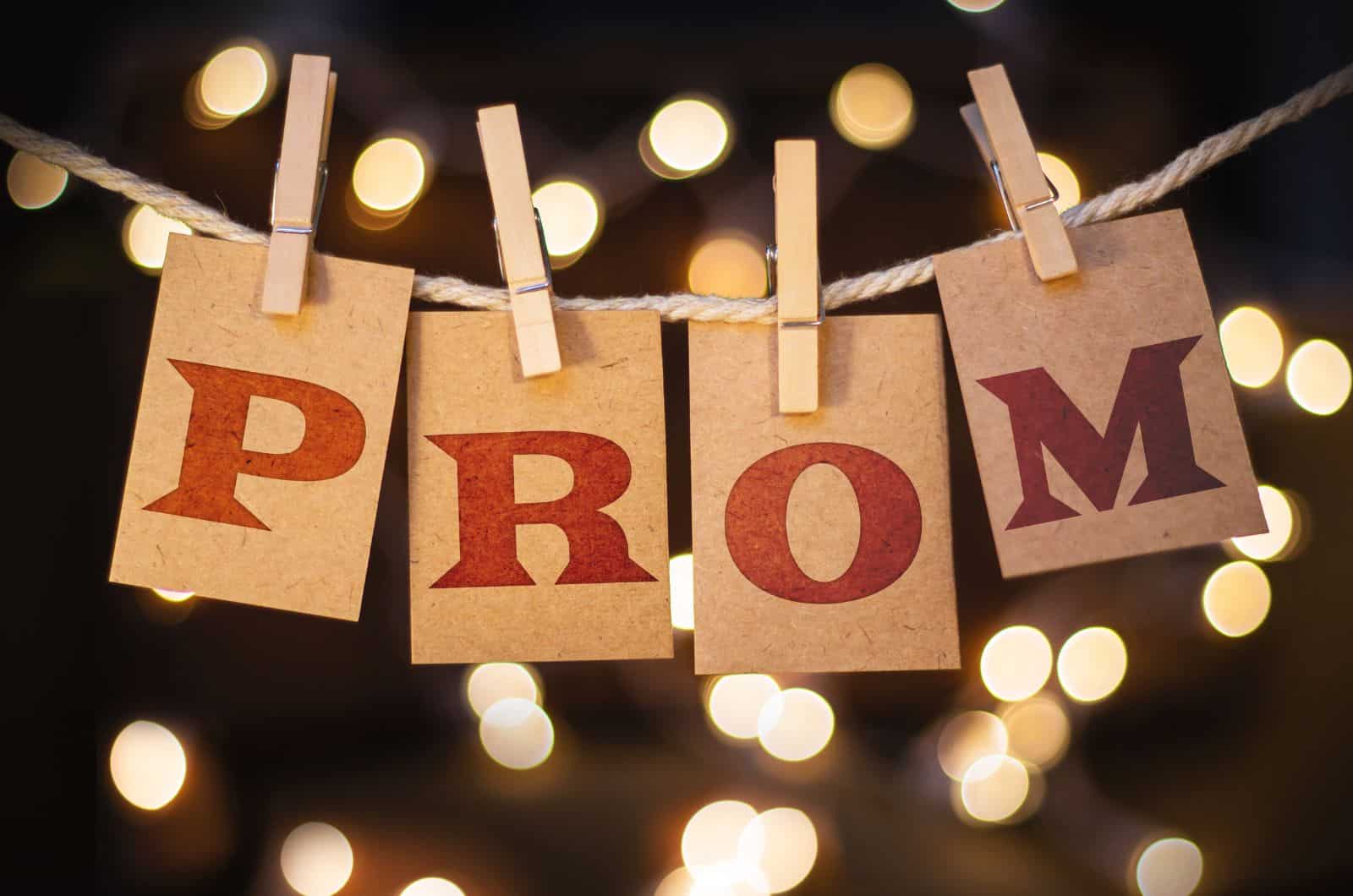 prom sign with fairy lights in background