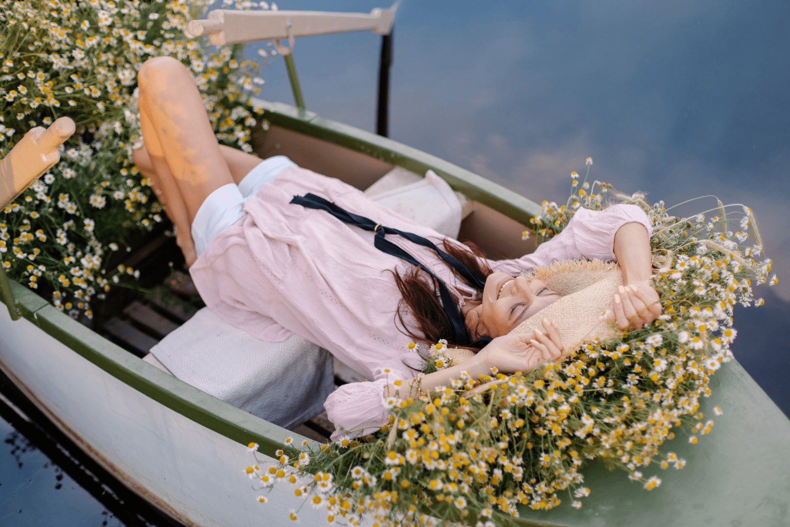 a beautiful woman enjoys a boat