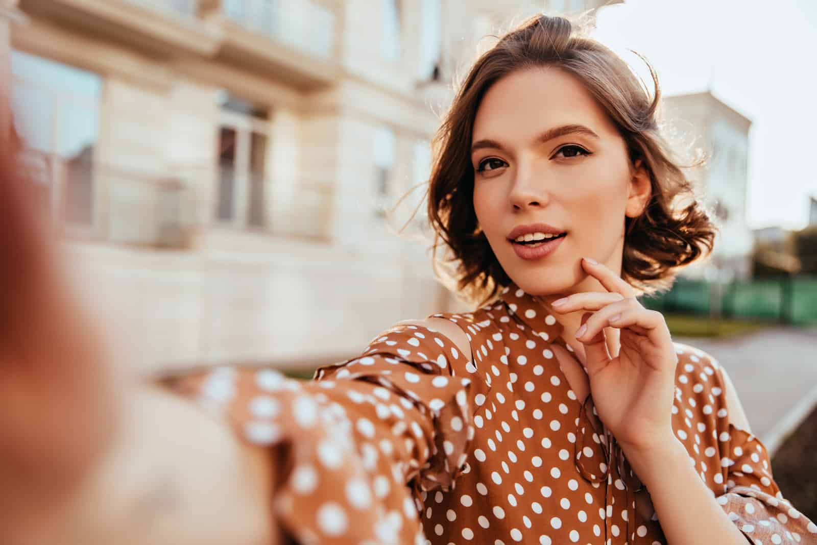 beautiful woman taking a selfie