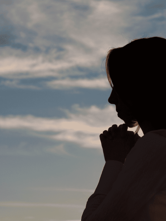 blue sky and woman praying