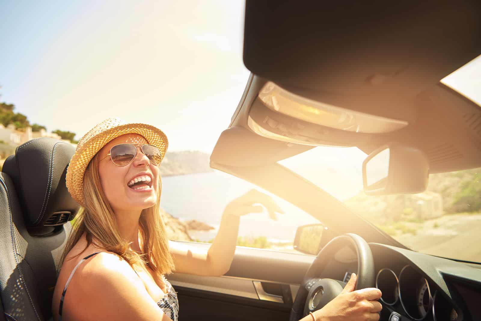 happy woman driving car