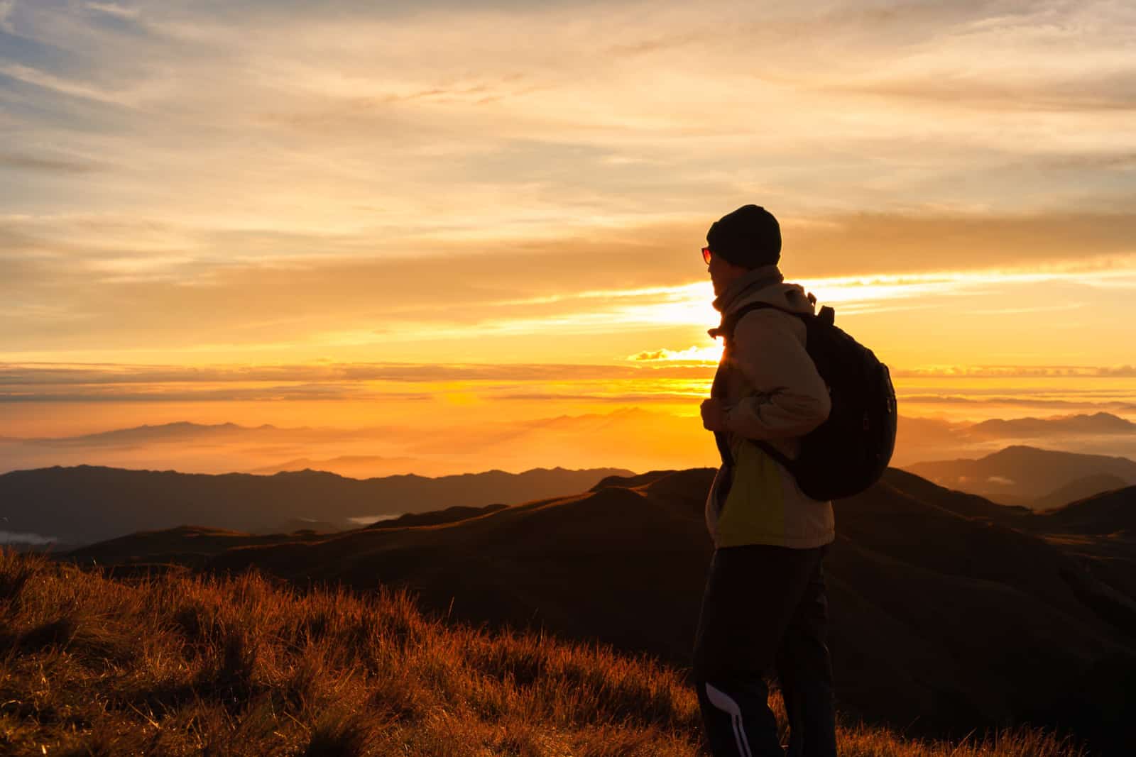 man hiking during golden hour