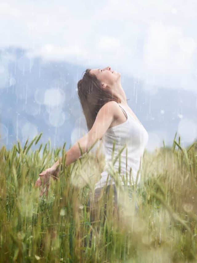woman dancing in the rain