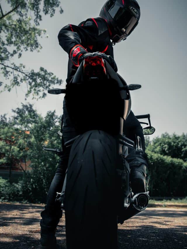 man sitting on a motorcycle