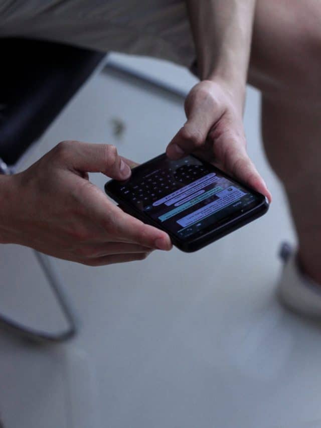 man holding a phone and reading a text